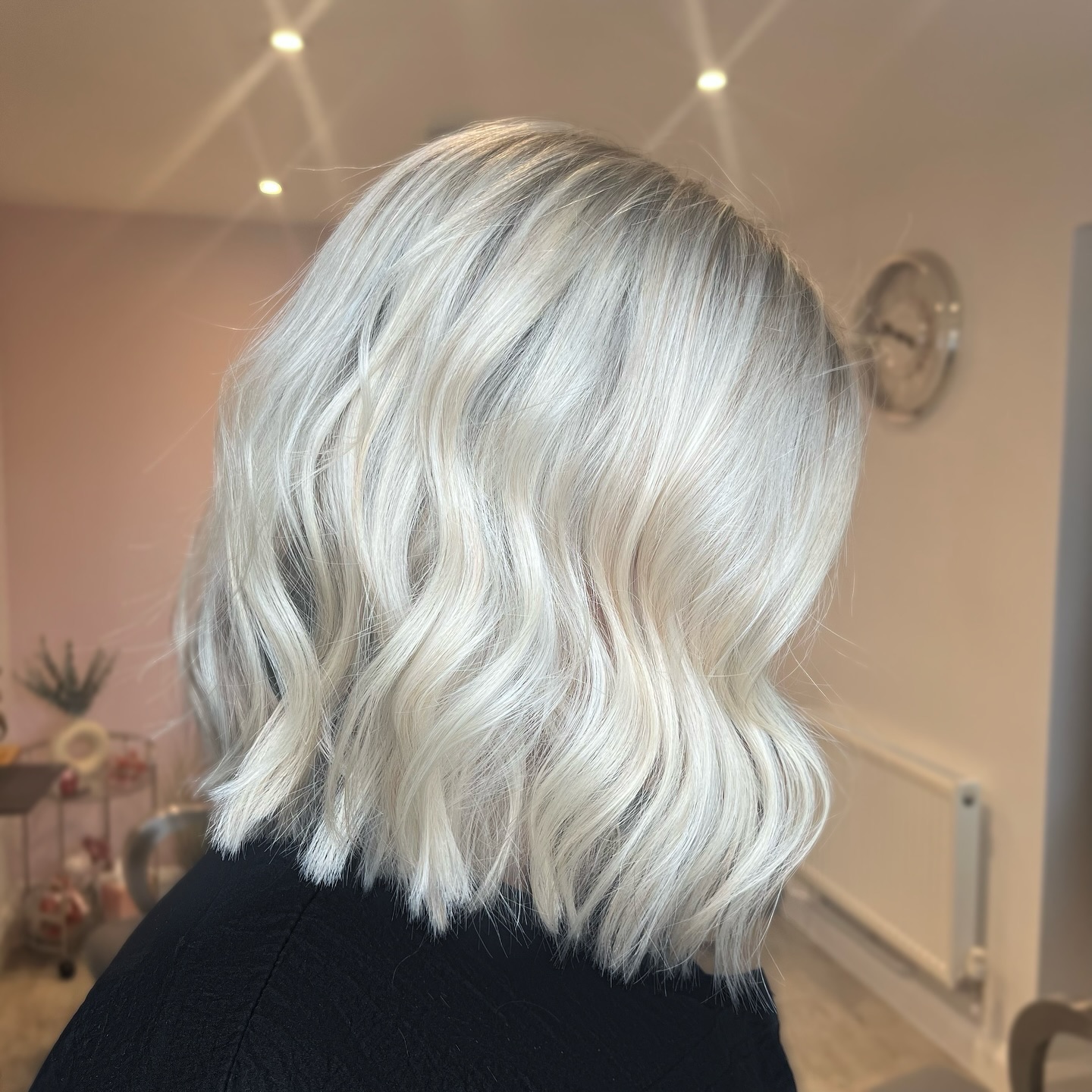 Glossy brunette waves with subtle warm highlights